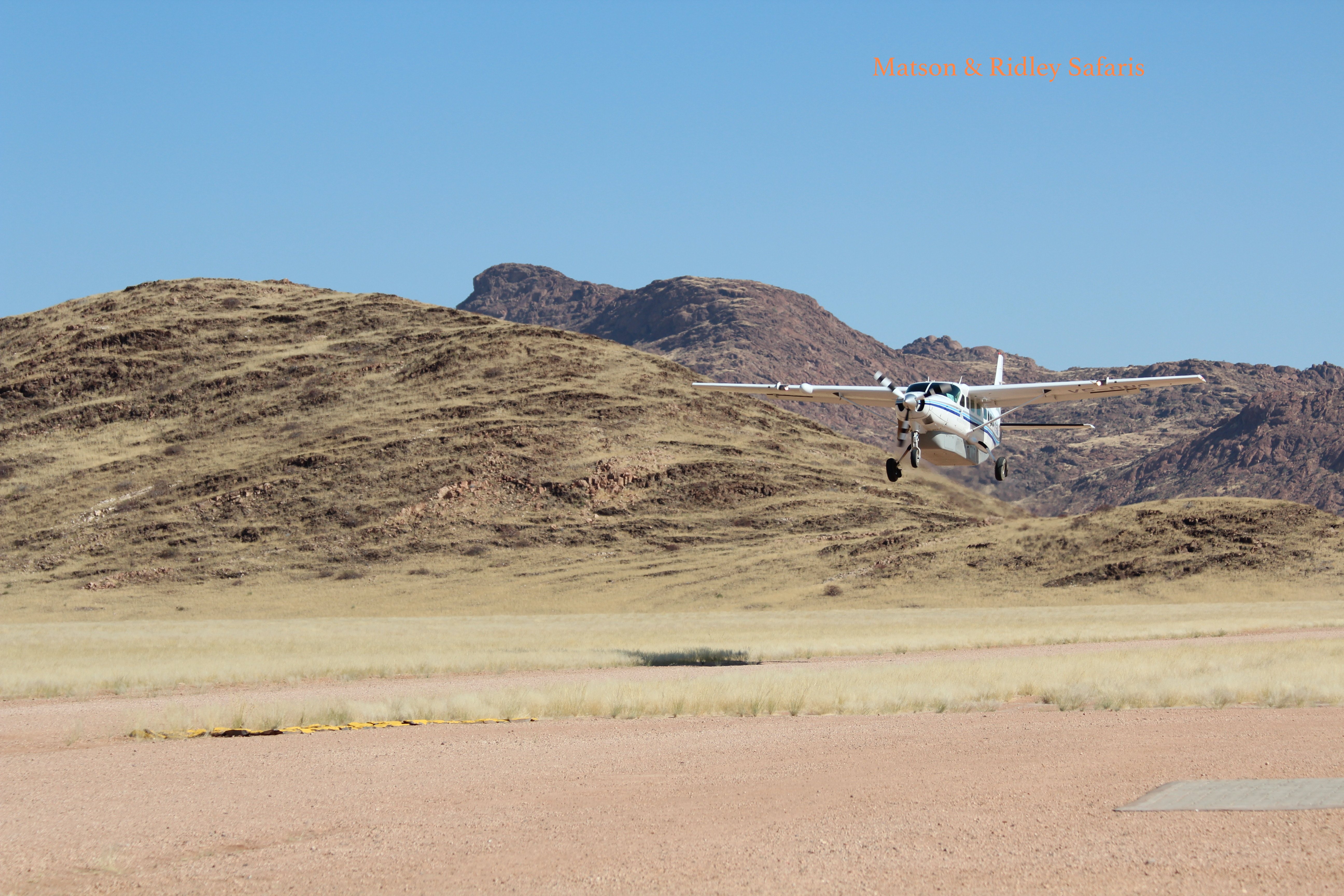 Wilderness Air plane takes off at Hoanib airstrip.